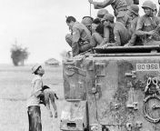 Pulitzer Prize winning photograph of a distraught father holding the body of his child as South Vietnamese Army Rangers look down from their armored vehicle. The child was killed as government forces pursued guerrillas into a village near the Cambodian bo from begusarai village chanpura sila devi image photo