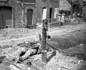 An American soldier lies dead beside water pump, killed by a German booby trap set in the pump in a French village on the Cherbourg Peninsula, on June 18, 1944. from aunty water pump in nity dress boobsndian bangla all tv serial actor nude fucking sex photoar plus veera nude boobs and ash picsxxx vedowww yes xxx
