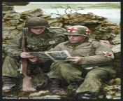 An American Medic and a GI of the US. 80th Infantry Division reading a comic at Reisdorf in Luxembourg near the German Border; 12-February-1945 Left to right : Pfc Reynold H. Bush Middletown, Ohio , and Pfc Aurelio Maltese, New York from nepal xxx ki chut s xxx salman khan and katrina k