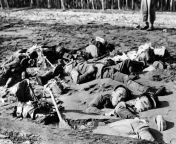 Japanese soldiers killed while manning a mortar on the beach are shown partially buried in the sand at Guadalcanal on the Solomon Islands following attack by U.S. Marines in August 1942. from solomon islands porn p