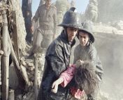 Afghan firefighters carry the body of a young girl killed in a powerful bomb blast in Kabul at May 14, 1988. At least eight people were killed and more than 20 injured by the explosion, believed to bomb was planted in a truck on the eve of the Soviet with from kabul umar sari video