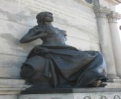 A Civil War monument in Iowa, USA. Designed by Harriet Ketcham whose design won a contest for a new local monument in 1894. The woman is said to be an allegorial figure of Iowa representing the state as a beautiful, youthful mother offering nourishment to from pashto new local kissing