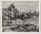 A group of Marines, dressed in captured trophy Japanese uniforms, pose in front of a pile of dead Japanese soldiers. Tarawa. November 1943. from japanese gadis bawa