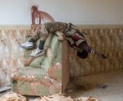 The Battle of Mosula dead body slumped on a sofa in Mosul, Iraq (X-post r/UnchainedMelancholy) from girl dead body x