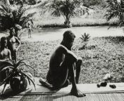 A slave looks at a hand and foot that was chopped off his 5yr old daughter during the &#39;rubber boom&#39;, Congo, Africa. 1904, photo from Anti-Slavery International. from africa jungle adivasi 3x movie