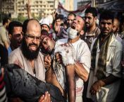 A man carries a dead protester in Cairo&#39;s Rabaa Adaweya square, after Sisi&#39;s military coup [NSFW][10YA - Jul 27] from actrss rabaa