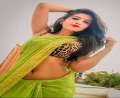 Aayushi Tyagi navel in green saree and brown sleeveless blouse from big indian boobs in green saree