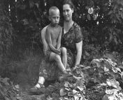 Vladimir Putin at the age of six, with his mother, in 1958. from xxx six with