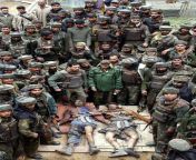 Indian Army soldiers pose with bodies of two terorist killed in a encounter at Gopalpur, Srinagar, Kashmir. 05 April 2005.[7251024] from srinagar gadwal mms