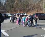 Connecticut State Police lead terrified students from the Sandy Hook Elementary School to safety after a mass shooting on Dec. 14, 2012 from www sxxxs 2012