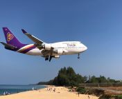 Thai airways B747 landing at Phuket International runway 27 over the beach. from chinese airways