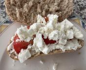 Wet tomato &amp; dry cheese concoction on dry bread from tomato gay
