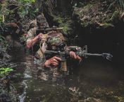 Green Berets in Okinawa, Japan, moving through ankle-high water during the 4th Marine Regiment Jungle Warfare Exercise at the Jungle Warfare Training Center [660495] from xxx water sprinkling the nude