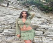a young girl, with big tits, in a green thing, in front of a rock... from desi young girl bouncing big boobs in bathroom mp4 download file