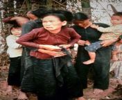 A Vietnamese teenager buttons up her Mothers blouse after she was sexually assaulted by American GI&#39;s. They were gunned down moments after this photo was taken. My Lai Massacre, Vietnam. 16 March 1968. from desi village aunty after fuck blouse open covered by