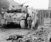 [NSFW] A GI of the 94th Div. passes a M4A3 (76mm) of the 778th Tank Battalion that has been knocked out during the fighting for the Saarbrcken bridgehead. 1945. from slave passes out during brutal whipping