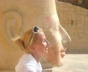 A foreign tourist took a picture of her next to the statue of Queen Hatshepsut. Source: Unknown from sex tourist fucks a african