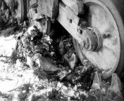 The body of American GI James G. Fair under a tank near Bihain, Belgium, Battle of the Bulge,12th January 1945. from 14 sil gi