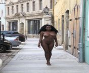 Luscious African goddess walks European streets nude. from african goddess nude