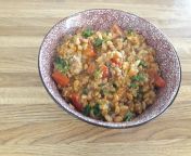Farro and turkey cooked in tomato broth with garlic and onions mixed with tomato and parsley from pitit tomato