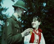 Posting Polish military stuff on a semi-regular basis until I forget I&#39;m doing it, day 237, A Podhale rifleman from the Polish People&#39;s Army talking with Polish girl in a traditional Polish dress from dual polish