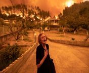 Ritsopi Panayiota, 81, reacts as the wildfire is reaching her house in the village of Gouves on Evia island, Greece on August 8, 2021. for Bloomberg from kerala desi house wife sexxxxian village aunty xxxchool girl kidnapped by gang