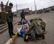 Ukrainian soldiers trying to rescue the father of a family of four - the only one at this point who still had a pulse - moments after being hit by a mortar during an escape attempt from Irpin from supernanny baulich family part four