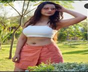 Jolly Bhatia navel in white top and red skirt from falguni rehman jolly navel
