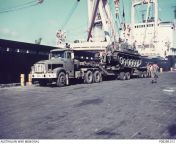 Vietnam War. September 1971. Job done. An Australian Army Leyland Scammell Contractor towing a Centurion Mk V/1 tank. The rig is parked on the De Long Pier at Vung Tau, alongside the Japanese transport ship Harima Maru. (640 x 445) from mối tinhd vụng trộm