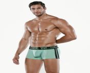 Enhancing trunks in turquoise with black detailing by CODE 22. The Motion Push-Up Trunks are an amalgam of futuristic and athletic design elements in one striking pair of underwear from trunks