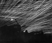 Anti-aircraft tracers in the night sky above Yontan Airfield on the island of Okinawa, April 28, 1945 [720x570] from 1974 the likes of louise