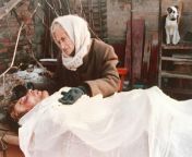 A mother weeps beside the body of her son, killed in the battle between Russian Army forces and Chechen separatists, in the shattered Chechen town of Gudermes, 1995. from mother stuck in the sink and her son inserted