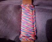 An oak (I think) spanking ruler style thing with rainbow parachord wrap and 2 turk knots from turk
