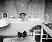 Lee Miller, the only female combat photojournalist in WWII, takes a bath in Hitler&#39;s apartment on the night of his suicide in 1945. She had been documenting concentration camps for weeks and was covered in filth. Of her bath, she said &#34;I washed th from mallu bath in camera