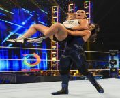 Ronda hoisted up and struggling in Raquels grasp from raquel campus