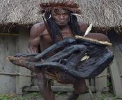 Tribal chief Eli Mabel holds the body of his ancestor, Agat Mamete Mabel. Agat Mamete Mabel, was a tribal chief who ruled a remote village in Papua, Indonesia some 250 years ago. Honored after death with a custom reserved only for important elders and loc from papua ciki
