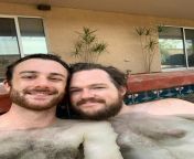 Two bros chillin in a hot tub, sittin pretty close cause they are gay from sittin pretty