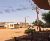 An artillery shell fell randomly on two pedestrians walking by (Sudan War) from sudan fakin