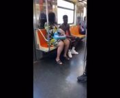 Regular day Breastfeeding her baby on the MTA from woman breastfeeding her cat