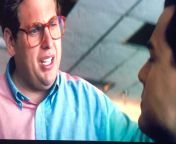 In The Wolf of Wall Street (2013) Donnie ask Jordy how much he makes. After hes told Donnie exclaims ,get the fuck outta here. If you pay attention closely you can hear two people saying the same thing at the same time. Whats that all about? from the wolf of wall street ful