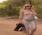 Braless beauty in see-thru dress on her way to topless beach from topless beach